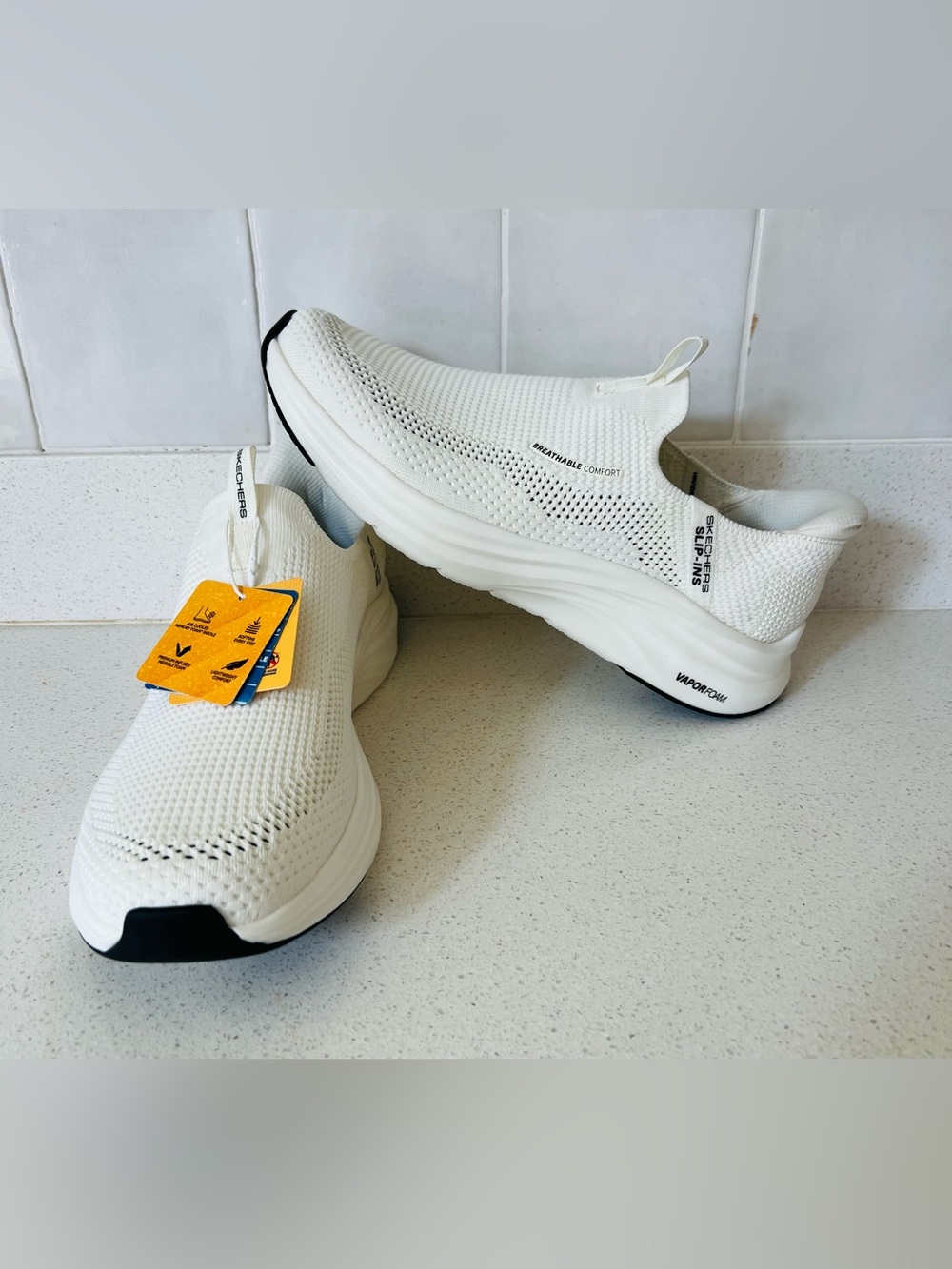 Skechers Men’s White Slip-On Knit Sneakers with Black Accents